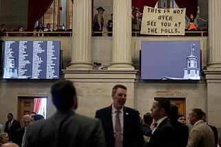 Protesters display a banner over the House chamber floor during the last day of the legislative session Thursday in Nashville. Tennessee's legislative session ended with several contentious bills making it to Gov. Bill Lee's desk, while others were left on the cutting room floor. (AP Photo/George Walker IV)